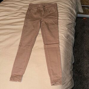 Tan American Eagle skinny jeans
